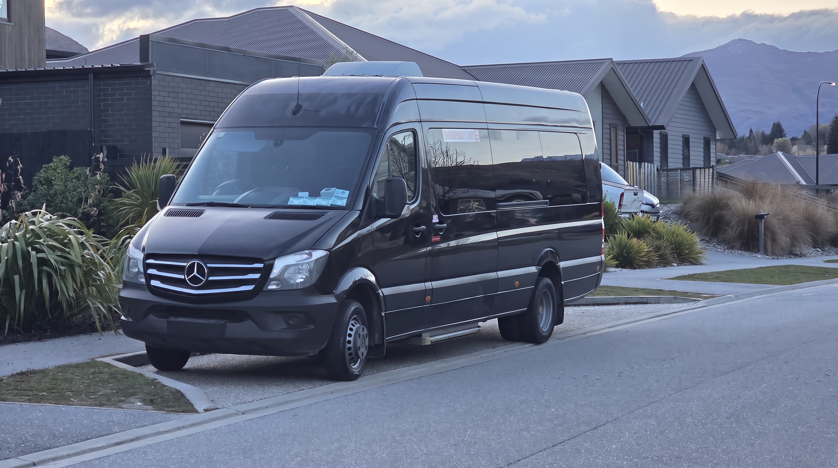 Black Mercedes-Benz Sprinter luxury tour van